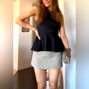 Peplum black sleeveless top